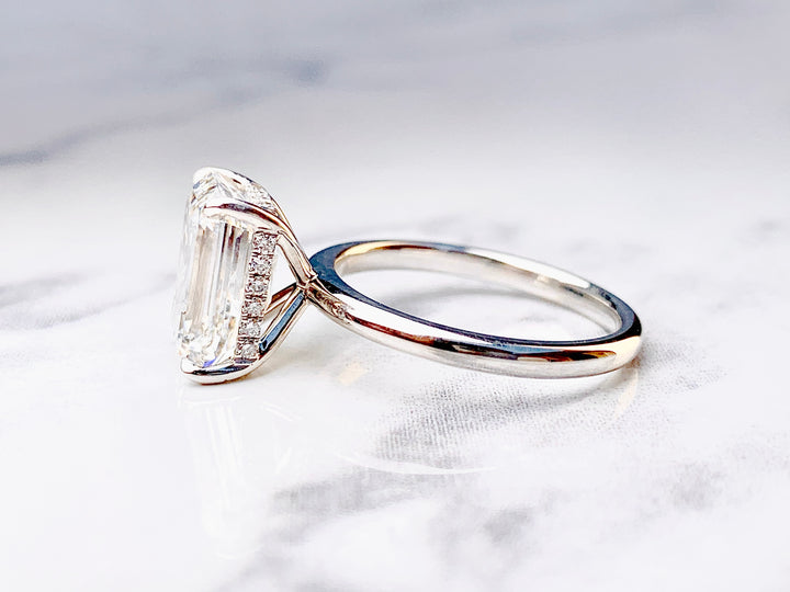 Emerald Cut Solitaire with Hidden Diamond Halo