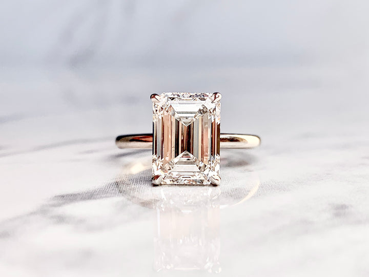 Emerald Cut Solitaire with Hidden Diamond Halo