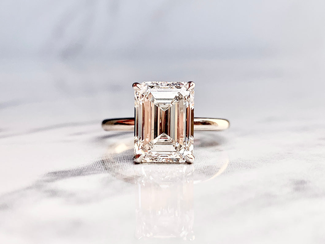 Emerald Cut Solitaire with Hidden Diamond Halo